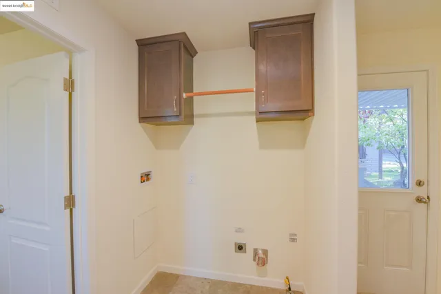 a view of workspace with window and closet