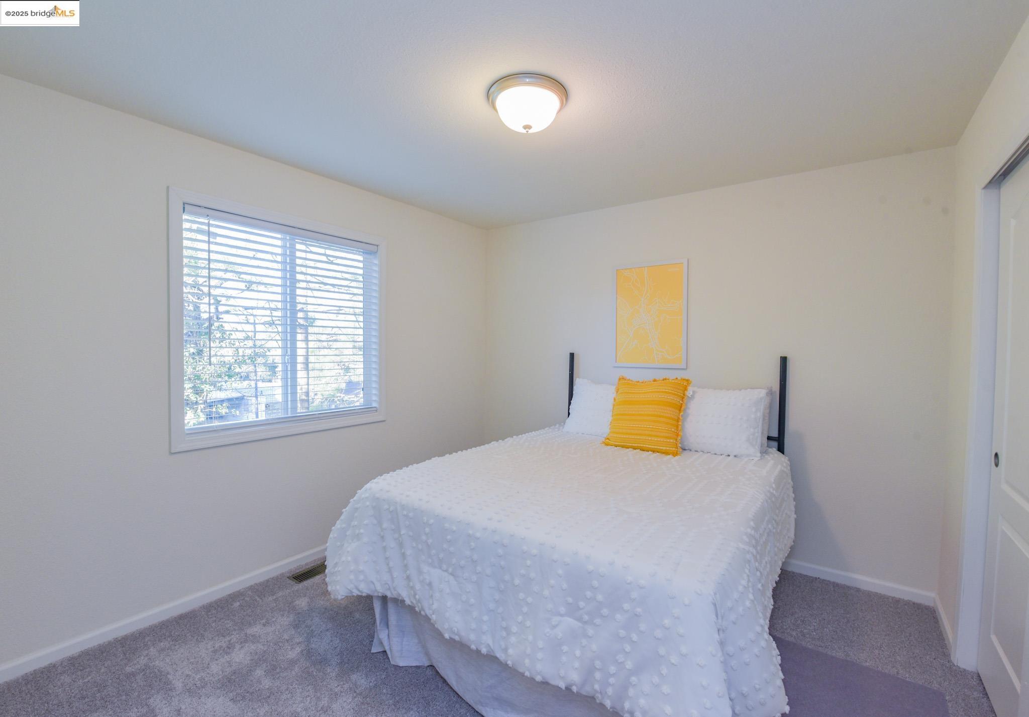 10956 Green Street Columbia, CA 95310 - Photo 21 of 45 a bedroom with a bed and a window