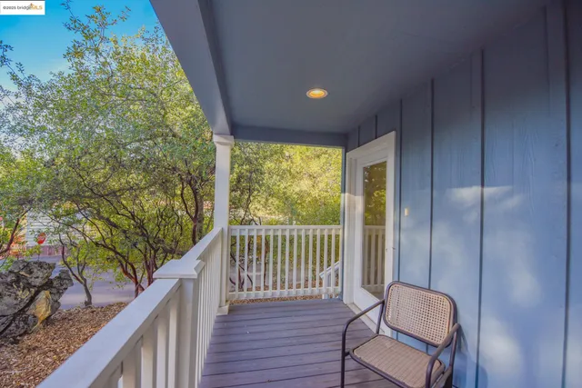 a view of balcony with wooden floor
