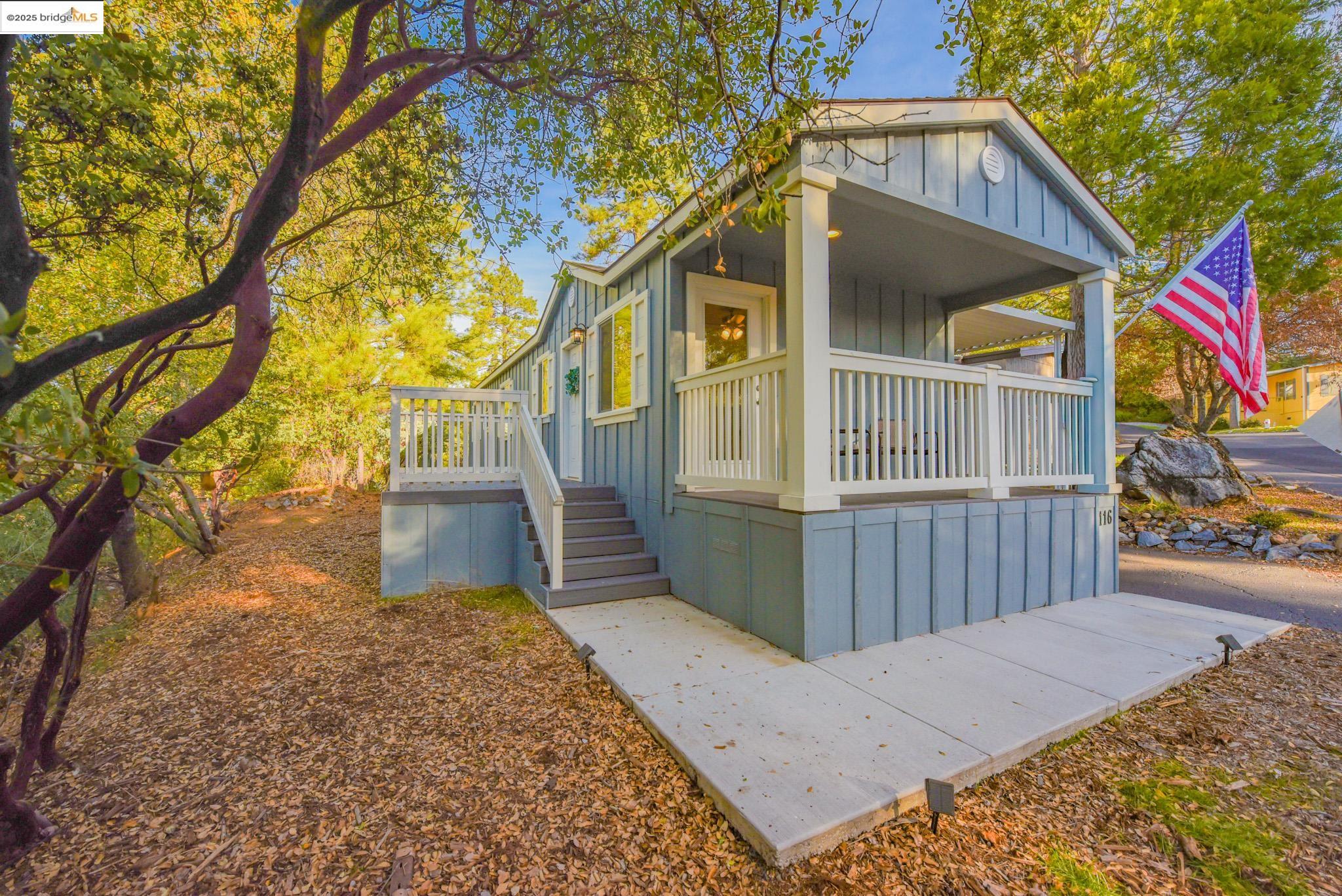 10956 Green Street Columbia, CA 95310 - Photo 3 of 45 a view of a house with a small yard and wooden fence