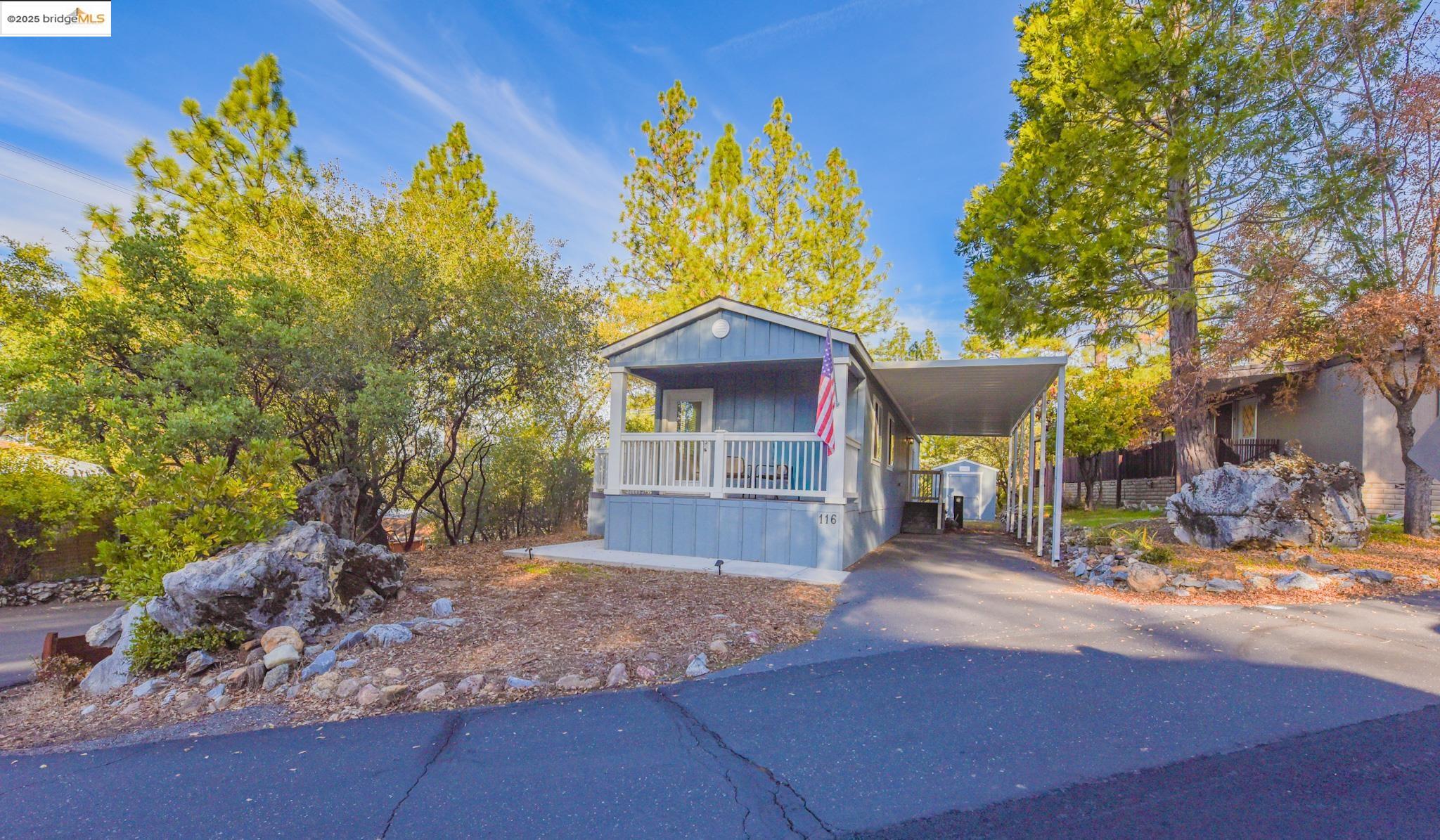 10956 Green Street Columbia, CA 95310 - Photo 36 of 45 a front view of a house with a yard and porch