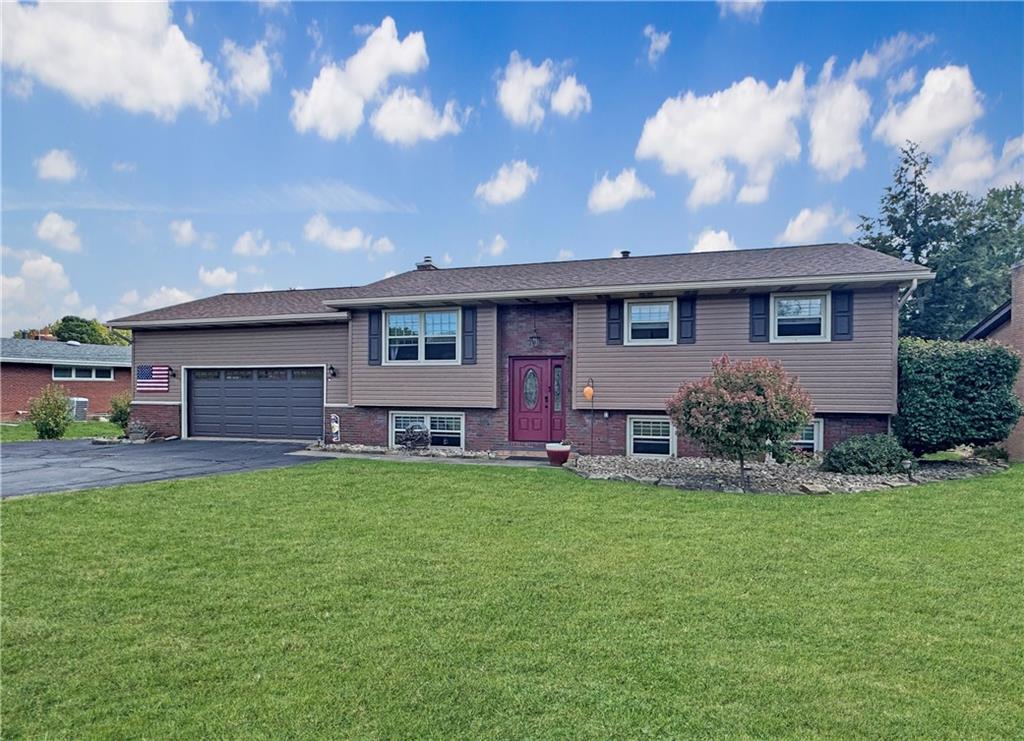 824 Shenango Road New Castle, PA 16101 - Photo 1 of 34 a view of a house with a yard and a tree