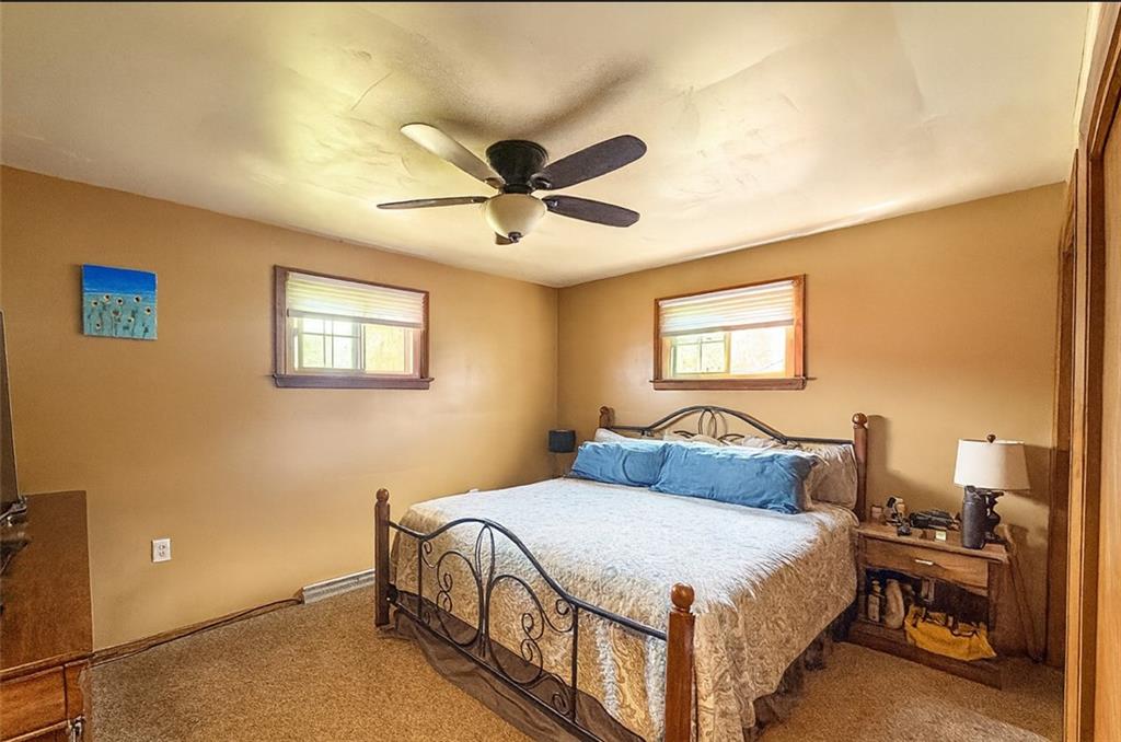 824 Shenango Road New Castle, PA 16101 - Photo 15 of 34 a bedroom with a bed and a chandelier