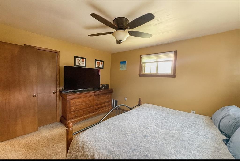 824 Shenango Road New Castle, PA 16101 - Photo 16 of 34 a bedroom with a bed and a flat screen tv