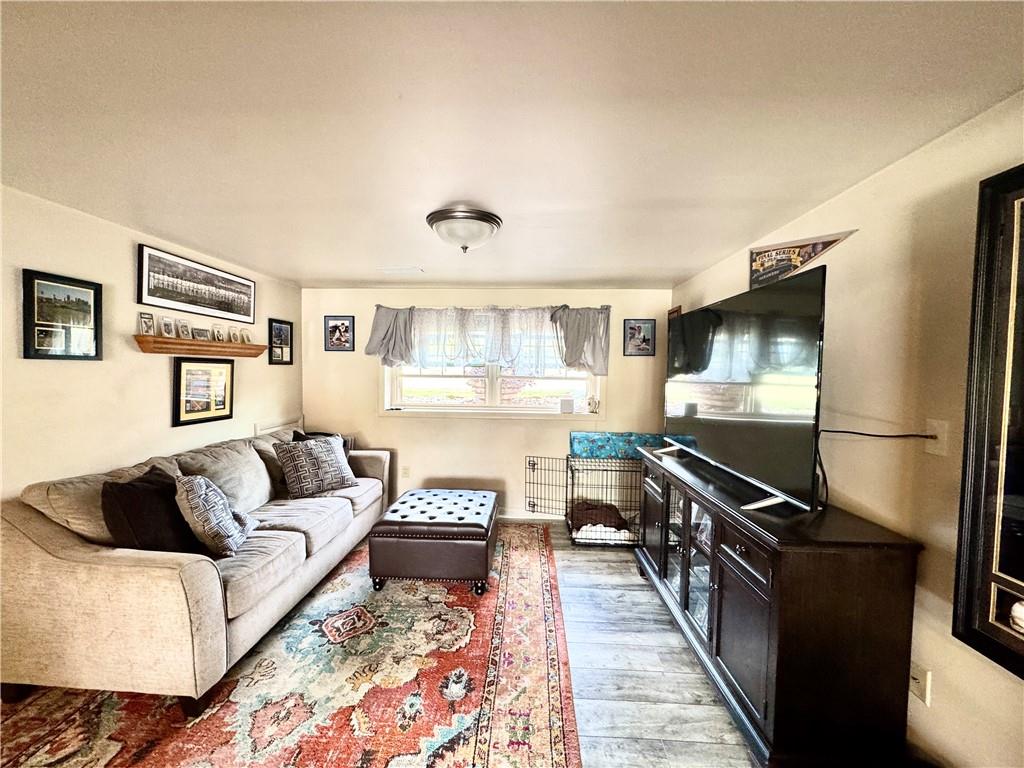 824 Shenango Road New Castle, PA 16101 - Photo 19 of 34 a living room with furniture and a flat screen tv