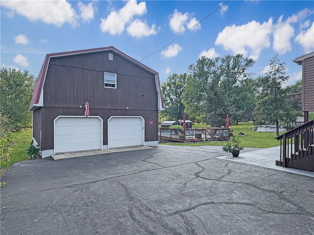 824 Shenango Road New Castle, PA 16101 - Photo 29 of 34 a view of a house with backyard and a tree