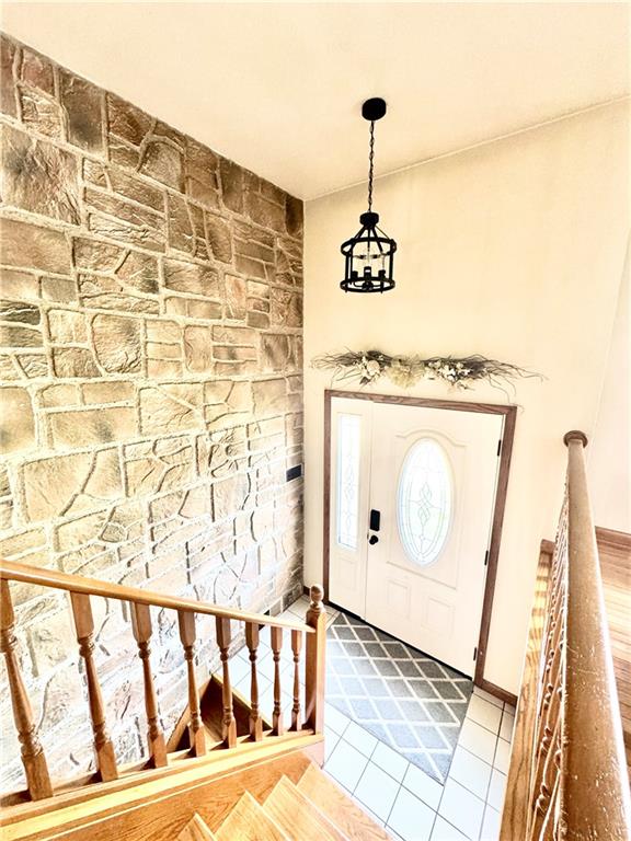 824 Shenango Road New Castle, PA 16101 - Photo 3 of 34 a view of a hallway with wooden floor and staircase