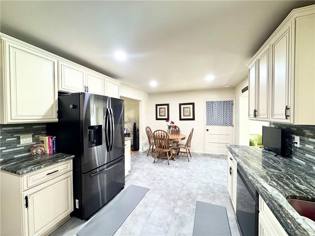 824 Shenango Road New Castle, PA 16101 - Photo 8 of 34 a kitchen with granite countertop a refrigerator stove top oven and sink