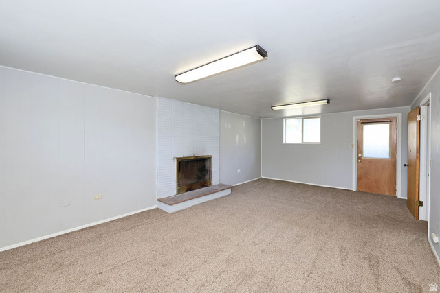 1272 Cook Street Ogden, UT 84404 - Photo 29 of 58 Spacious room featuring neutral carpeting and light gray walls