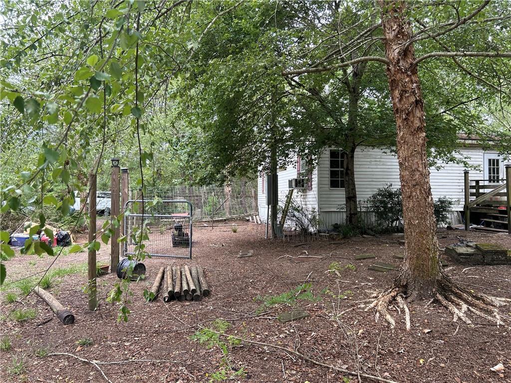 114 Jones Road Hortense, GA 31543 - Photo 11 of 25 a view of a patio with table and chairs next to a yard