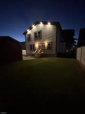 a view of a kitchen with cabinets and wooden floor