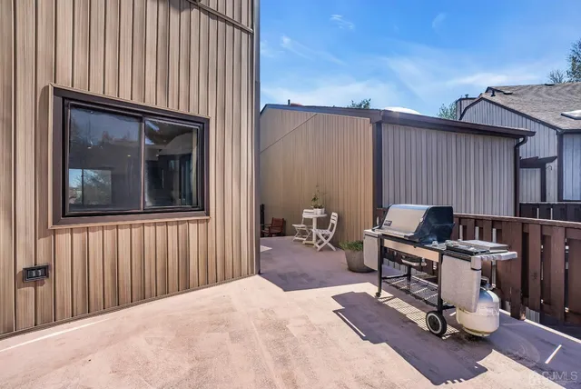 a balcony view with a seating space