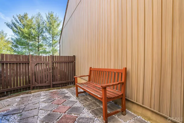a living room with a baby crib furniture and a window