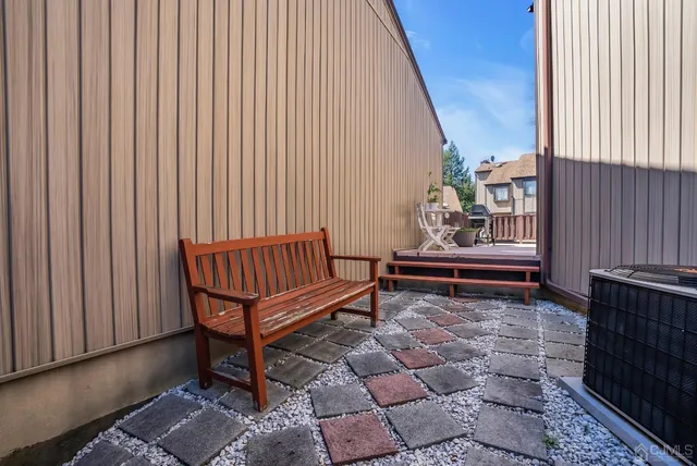 a living room with furniture potted plant and a window