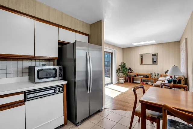 a room that has a door and a washer dryer