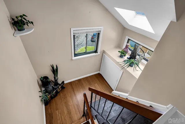 a spacious bedroom with a bed and a window