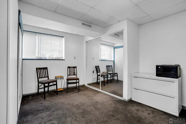 a view of a workspace with furniture