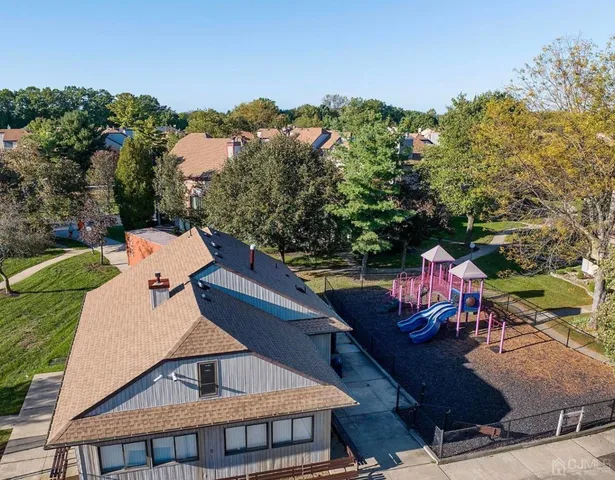 an aerial view of a house with a garden