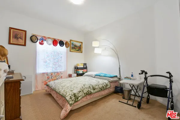 a bedroom with a bed and the table
