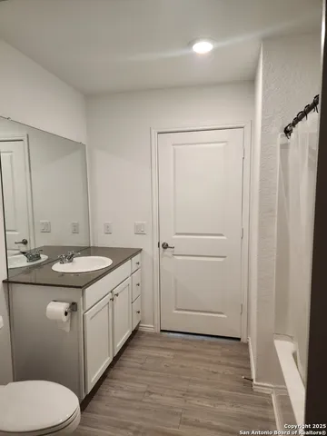 a bathroom with a sink toilet and vanity
