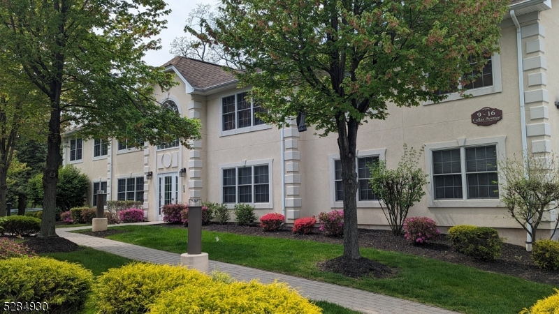 16 Cellar Avenue, Unit 16 Clark, NJ 07066 - Photo 1 of 12 a front view of a house with garden
