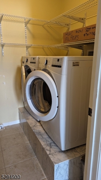 16 Cellar Avenue, Unit 16 Clark, NJ 07066 - Photo 11 of 12 a utility room with dryer and washer