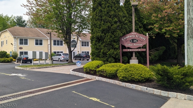 16 Cellar Avenue, Unit 16 Clark, NJ 07066 - Photo 2 of 12 a table and chairs in front of a house