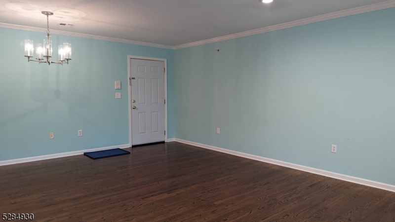 16 Cellar Avenue, Unit 16 Clark, NJ 07066 - Photo 7 of 12 a view of an empty room with wooden floor