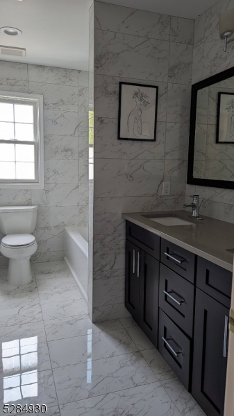 16 Cellar Avenue, Unit 16 Clark, NJ 07066 - Photo 9 of 12 a bathroom with a sink and a toilet