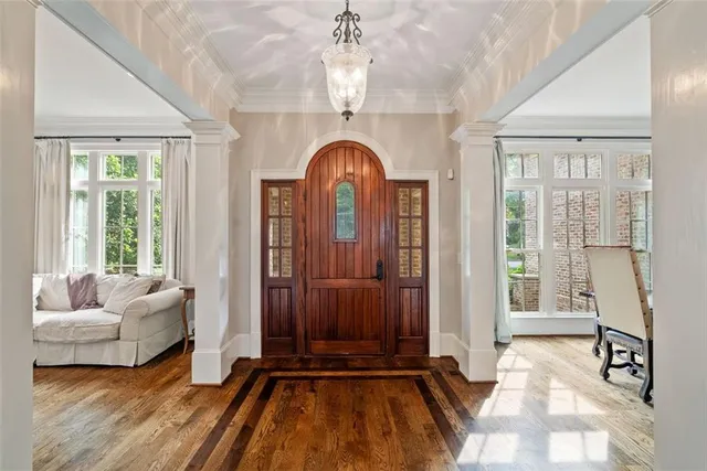 a kitchen with stainless steel appliances granite countertop white cabinets and a stove