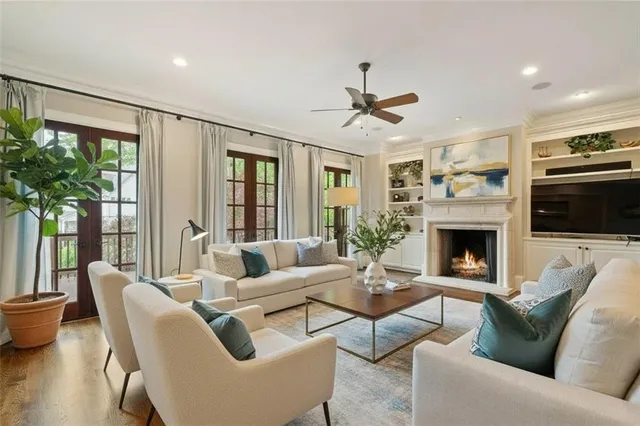 a bathroom with a granite countertop toilet a sink and a mirror