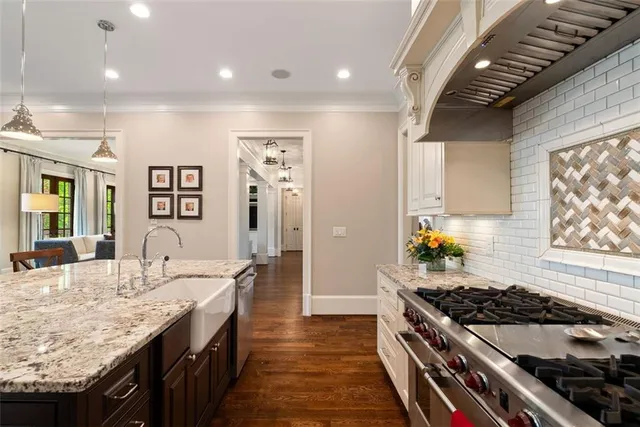 a spacious bathroom with a granite countertop sink mirror and a