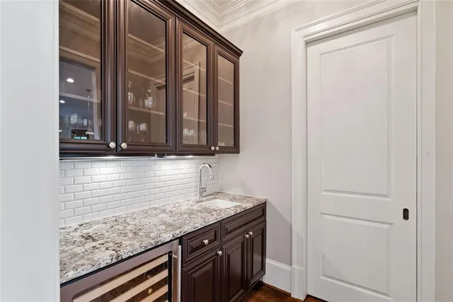 a white bath tub sitting in a bathroom next to a window