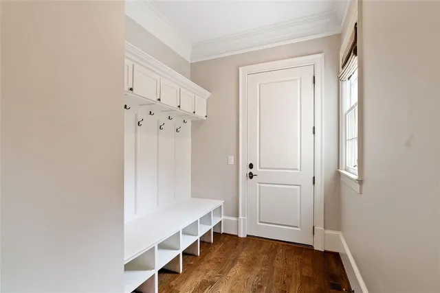 a bathroom with a granite countertop sink toilet and mirror