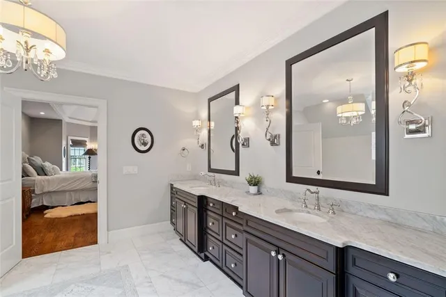 a bathroom with a shower sink and mirror