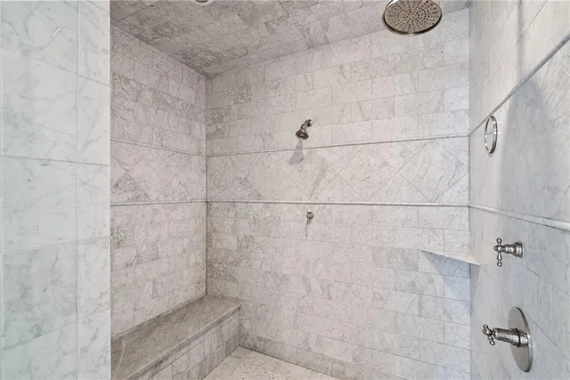 a outdoor space with a large window and furniture