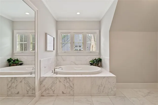 a view of a house with a yard table and chairs