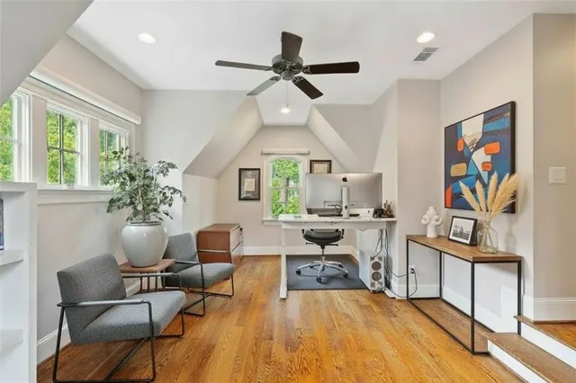 a view of a house with a yard and sitting area
