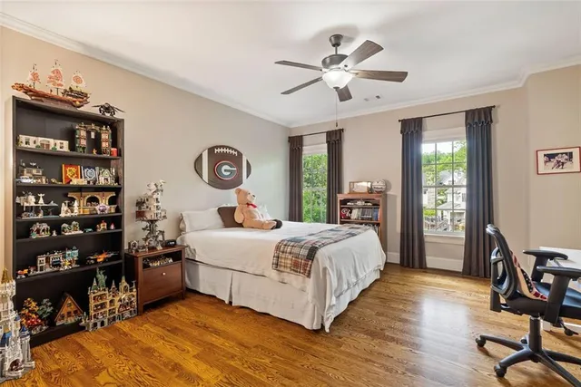 a view of walk in closet with wooden floor