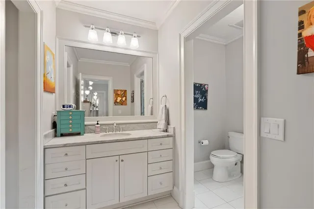 a view of a livingroom with furniture and windows in it