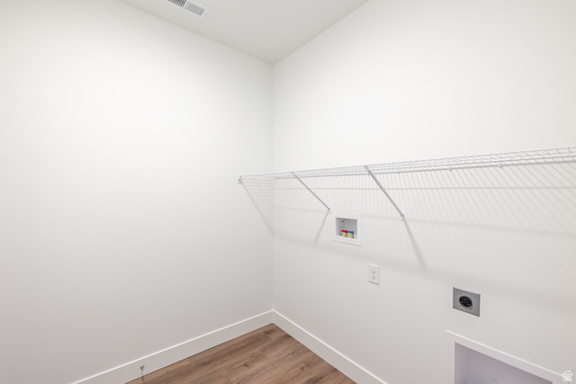 675 West 4500th South, Unit P302 Mapleton, UT 84664 - Photo 4 of 16 Dedicated utility space featuring wood-finish flooring, white walls, and a wire shelving unit