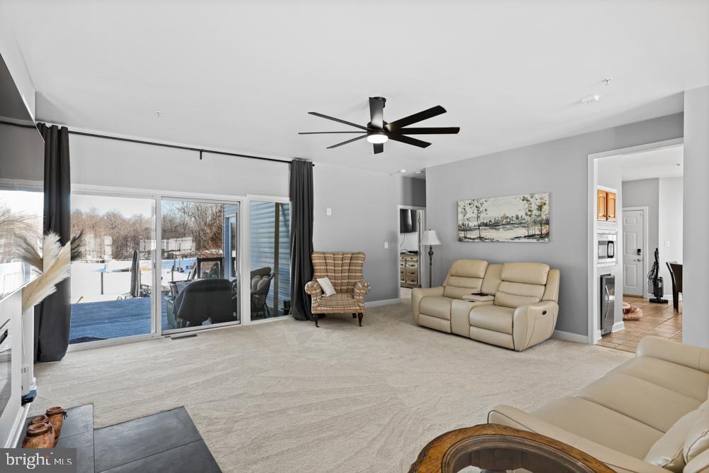 13710 Baden Naylor Road Upper Marlboro, MD 20772 - Photo 12 of 66 a living room with furniture and a large window