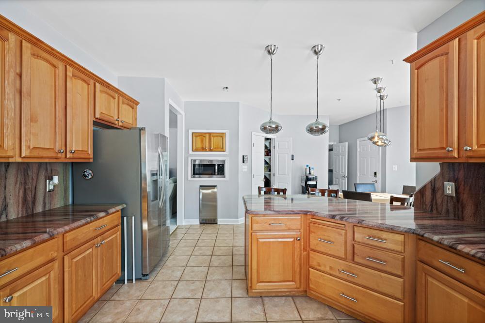 13710 Baden Naylor Road Upper Marlboro, MD 20772 - Photo 17 of 66 a kitchen with stainless steel appliances granite countertop a sink a stove and refrigerator