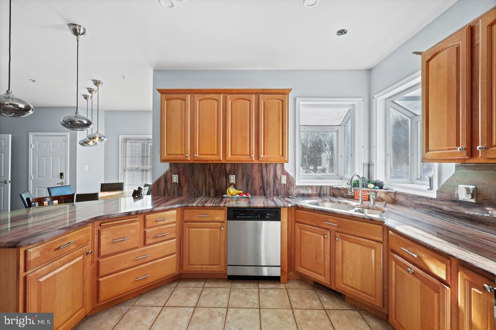13710 Baden Naylor Road Upper Marlboro, MD 20772 - Photo 18 of 66 a kitchen with a sink stove and cabinets