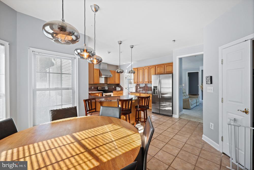 13710 Baden Naylor Road Upper Marlboro, MD 20772 - Photo 19 of 66 a very nice looking dining room with a table and chairs