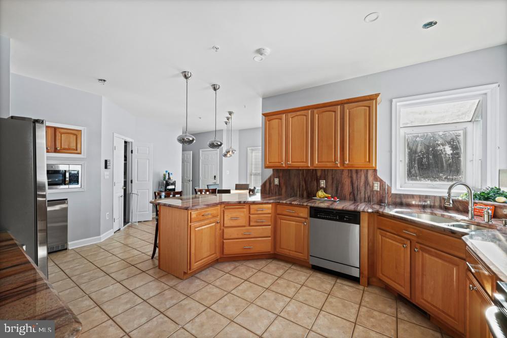 13710 Baden Naylor Road Upper Marlboro, MD 20772 - Photo 20 of 66 a kitchen with stainless steel appliances granite countertop a sink stove and refrigerator