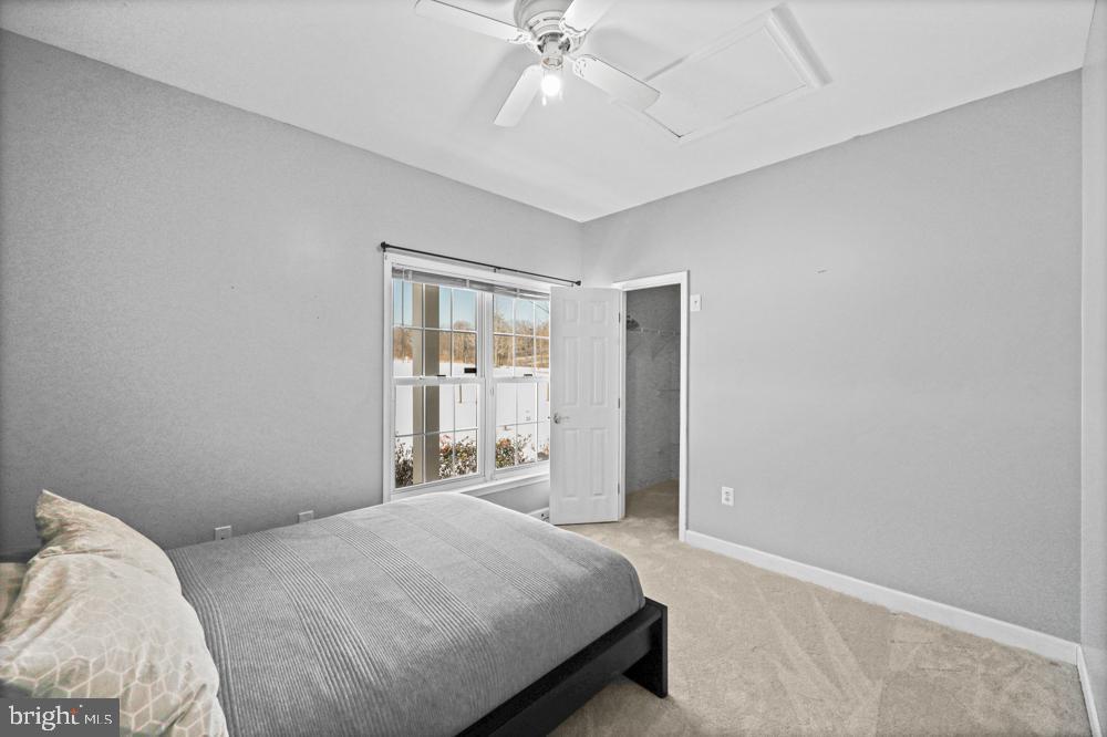 13710 Baden Naylor Road Upper Marlboro, MD 20772 - Photo 34 of 66 a bedroom with a bed and a chandelier