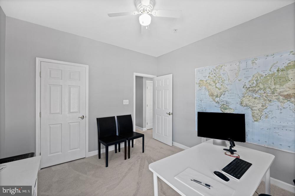 13710 Baden Naylor Road Upper Marlboro, MD 20772 - Photo 38 of 66 a work room with furniture and a flat screen tv