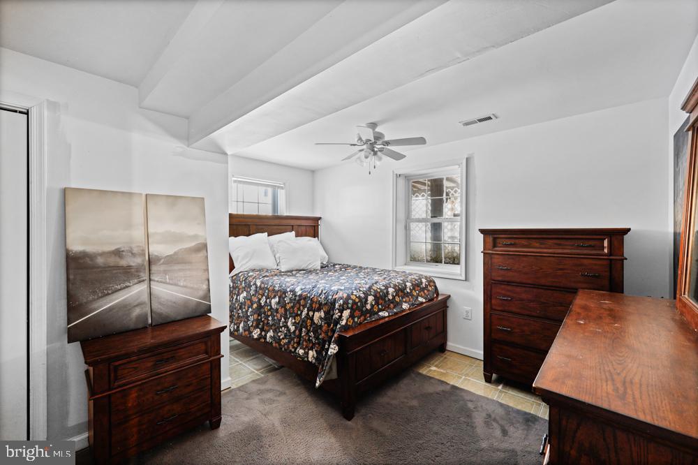 13710 Baden Naylor Road Upper Marlboro, MD 20772 - Photo 46 of 66 a bedroom with a bed and a dresser