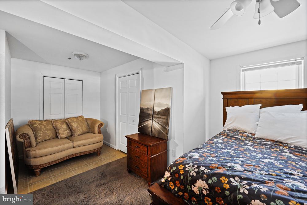 13710 Baden Naylor Road Upper Marlboro, MD 20772 - Photo 47 of 66 a bedroom with a bed and a couch